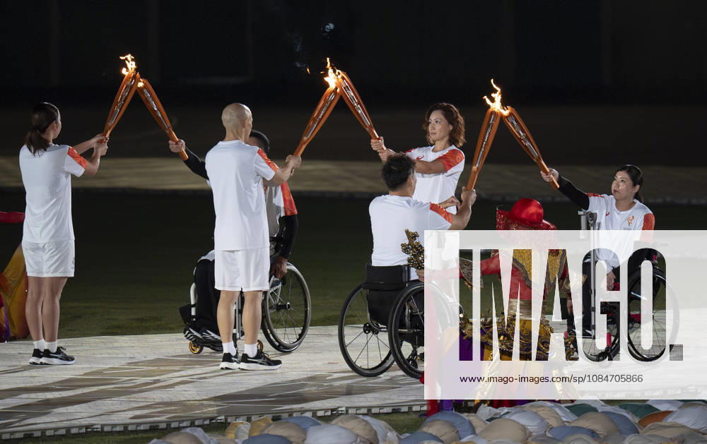 (261018) -- NAGOYA, Oct. 18, 2026 -- Torch bearers hand over the flame during the opening ceremony of the Aichi-Nagoya Asian Para Games in Nagoya, Japan, Oct. 18, 2026. ) (SP)JAPAN-NAGOYA-ASIAN PARA GAMES-OPENING CEREMONY CaixYang