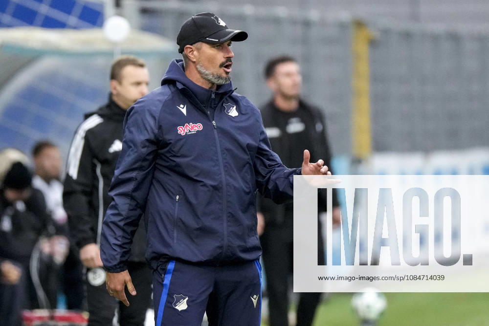 Stefan Kleineheismann, coach and head coach of TSG II, gives instructions, gesturing with his arms; single frame, single photo, action, October 18, 2026, Sinsheim, Germany, soccer, 3rd Division, TSG 1899 Hoffenheim II vs. SC Verl; DFB and DFL regulations prohibit any use of photographs as image sequences and or quasi-video