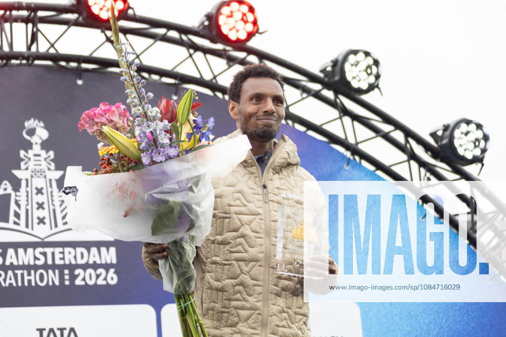 (261018) -- AMSTERDAM, Oct. 18, 2026 -- Lemi Berhanu of Ethiopia displays his trophy on the awarding podium after winning the men s race of the Amsterdam Marathon in Amsterdam, the Netherlands, Oct. 18, 2026. (Photo by Xinhua) (SP)THE NETHERLANDS-AMSTERDAM-MARATHON SylviaxLederer