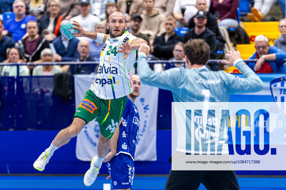 L R Marcel Schiller, Frisch Auf Göppingen, No. 24, taking a shot on goal against Constantin Moestl, TBV Lemgo Lippe, No. 01 GER; TBV Lemgo Lippe vs. Frisch Auf Göppingen, Handball, 1st Bundesliga, Matchday 9, 2026–2027 season, October 18, 2026 GER, TBV Lemgo Lippe vs. Frisch Auf Goeppingen, Handball, 1st Bundesliga, Matchday 9, 2026–2027 season, October 18, 2026 Lemgo