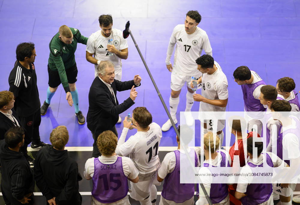 National team coach Marcel Loosveld (GER) gives instructions during a timeout, gesturing, surrounded by players during the Futsal World Cup qualifying match between Germany and Lithuania (4–2) on October 18, 2026, at the Westenergie Sporthalle in Mülheim an der Ruhr, Germany