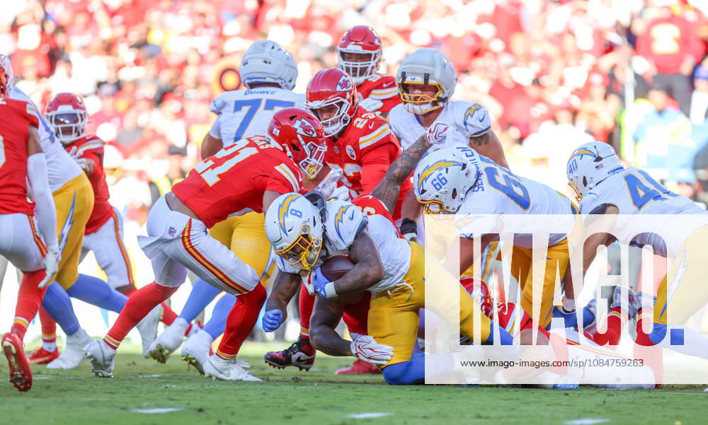 Oct 18, 2026: Los Angeles Chargers running back Omarion Hampton (8) gets tackled by Chiefs players in Kansas City, MO, USA; at Arrowhead Stadium. Mandatory Credit: -Cal Media Kansas City USA - ZUMAc04_ 20261018_zma_c04_231