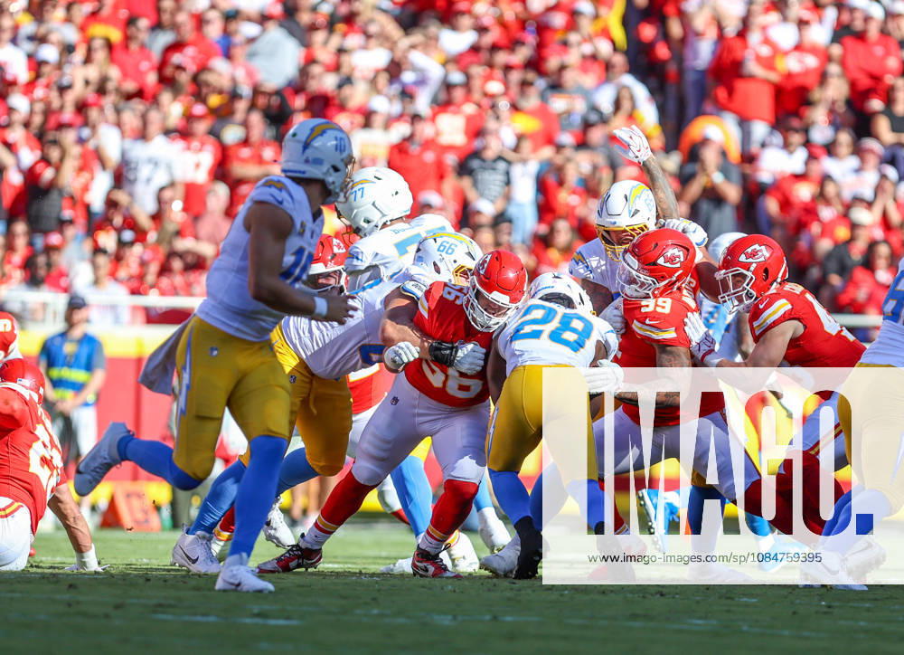 Oct 18, 2026: Los Angeles Chargers running back Kimani Vidal (28) runs through the defense and was tackled by Kansas City Chiefs defensive end George Karlaftis (56) and Kansas City Chiefs defensive lineman Peter Woods (99) in Kansas City, MO, USA; at Arrowhead Stadium. Mandatory Credit: -Cal Media NFL, American Football Herren, USA 2026: Chargers Vs Chiefs OCT 18 - ZUMAc04_ 20261018_zma_c04_246