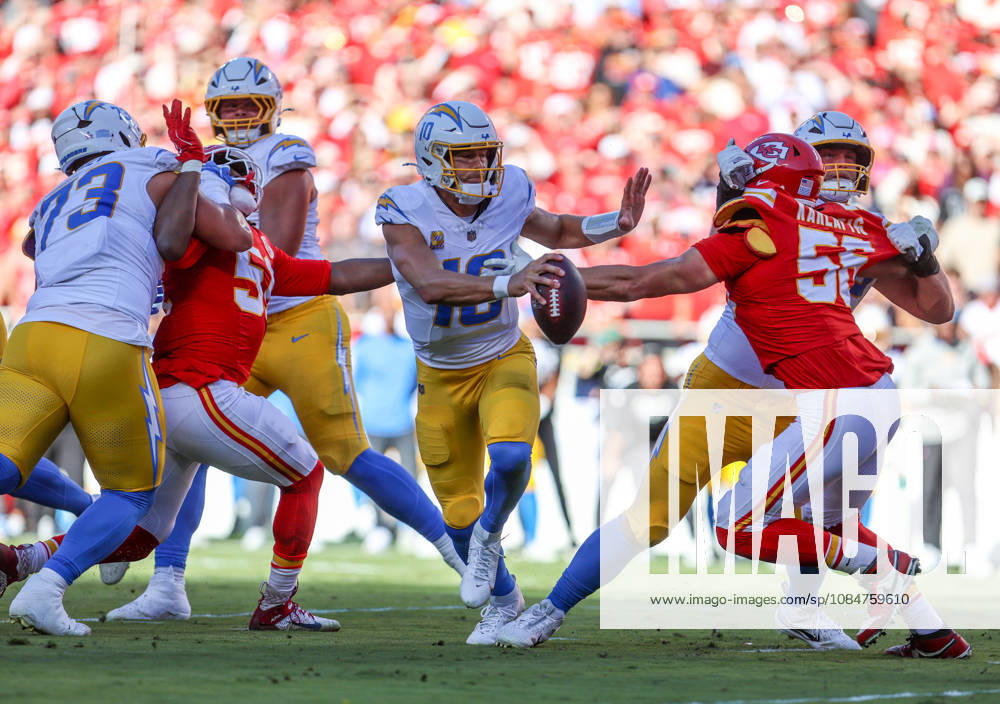Oct 18, 2026: Los Angeles Chargers quarterback Justin Herbert (10) tries to get away from Kansas City Chiefs defensive end George Karlaftis (56) in Kansas City, MO, USA; at Arrowhead Stadium. Mandatory Credit: -Cal Media Kansas City USA - ZUMAc04_ 20261018_zma_c04_205