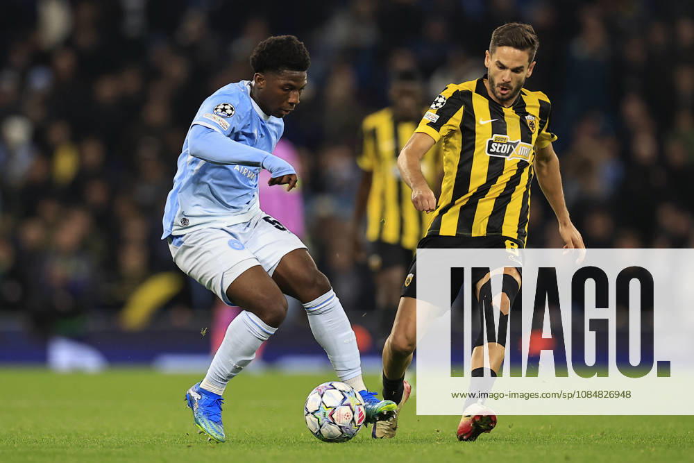 Manchester City v AEK Athens, Champions League Ryan McAidoo (56) of Manchester City is challenged by Mijat Gacinovic (8) of AEK Athens during the Champions League match between Manchester City and AEK Athens at the Etihad Stadium, Manchester, UK on 20 October 2026. Manchester Etihad Stadium Manchester UK Editorial use only ,