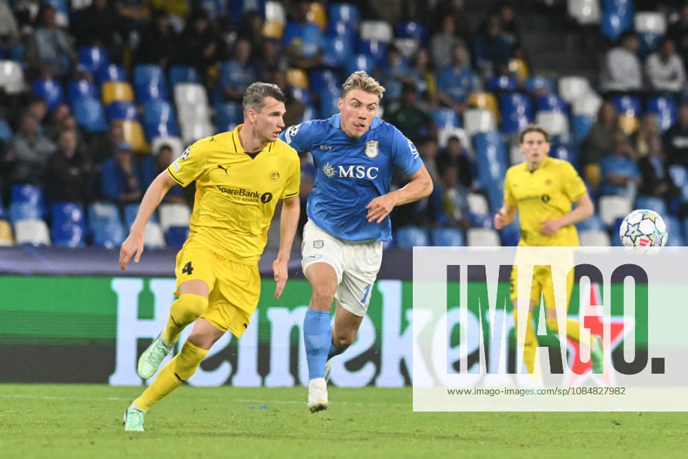 IPA89967122 - Odin Bjortuft of Bodo Glimt battles for the ball with Rasmus Hojlund of SSC Napoli during the UEFA Champions League match between SSC Napoli and Bodo Glimt at Diego Armando Maradona Stadium