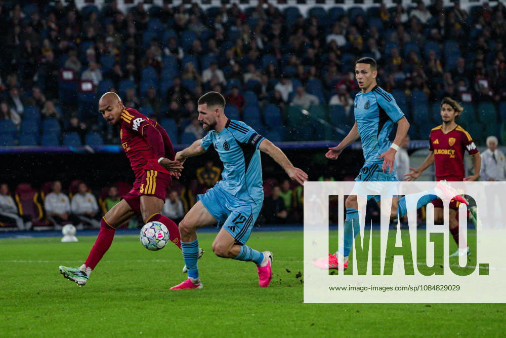IPA89968657 - Donyell Malen of AS Roma and Kenan Bajric of Slovan Bratislava during the AS Roma vs. Slovan Bratislava UEFA Champions League soccer match in Rome, Italy, on October 20, 2026