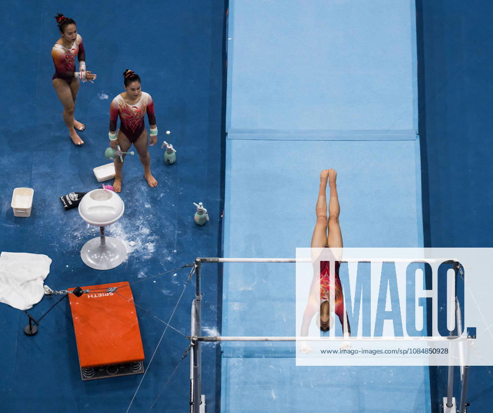 2026 Artistic Gymnastics World Championships, Day 5, Women’s Team Final, October 21, 2026: Qiyuan Qiu of China and Siyu Du of China watch Qingying Zhang of China warm up ahead of her uneven bars routine during the women’s team final on day five of the 2026 Artistic Gymnastics World Championships on October 21, 2026 in Rotterdam. Photo by Joel Marklund, BILDBYRÅN, code JM JM0863 bbeng artistic gymnastics artistic gymnastics gymnastics world championships world championships artistic gymnastics world championships final team final women’s team final