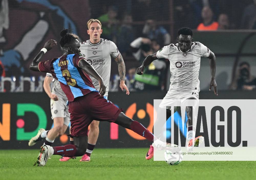 Trabzonspor v Hearts - UEFA Conference League TRABZON, TURKIYE - OCTOBER 22: Batista Mendy (L) of Trabzonspor in action against Rogers Mato of Hearts during UEFA Conference League week 2 football match between Trabzonspor and Hearts at Papara Park in Trabzon, Turkiye on October 22, 2026. Hakan Burak Altunoz Anadolu Trabzon Turkey. Editorial use only. Please get in touch for any other usage.