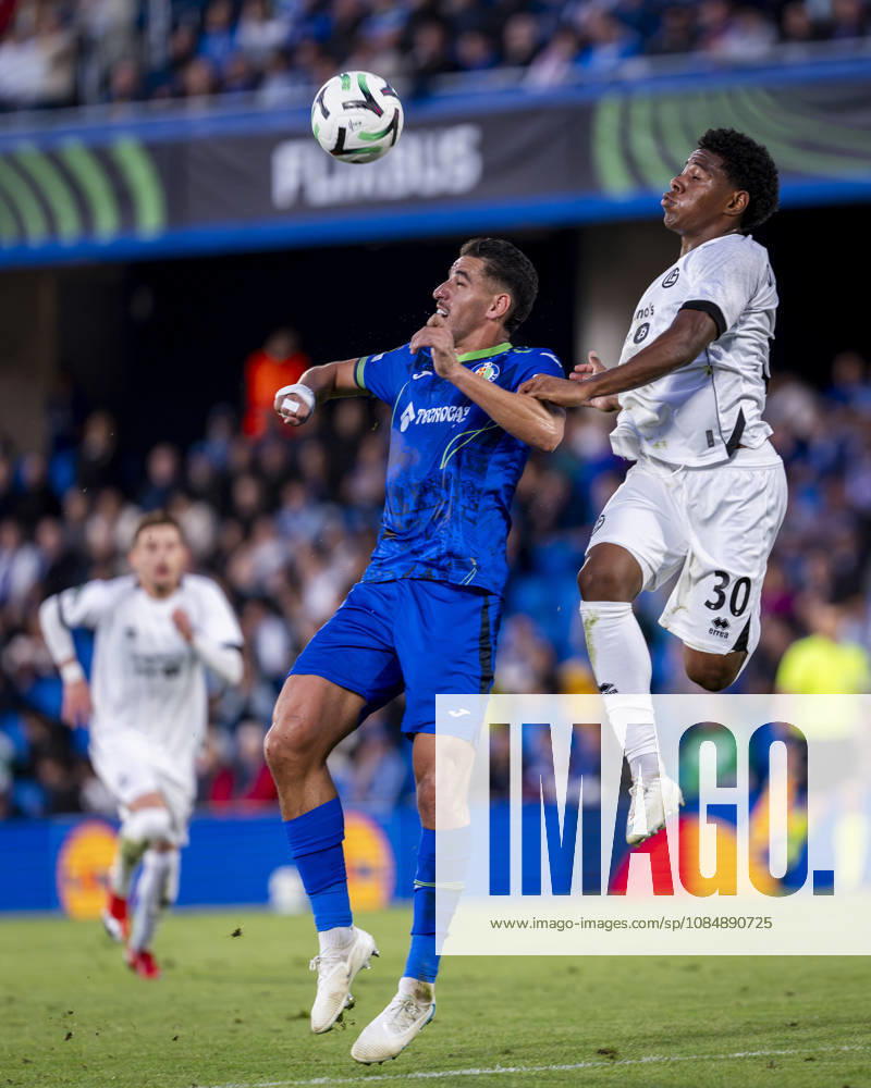 Getafe CF v FC Lugano - UEFA Conference League 2026 27 League Phase MD2 GETAFE, SPAIN - OCTOBER 22: Dereck Moncada of FC Lugano (R) heads the ball against Abdel Abqar of Getafe CF (L) during the UEFA Conference League 2026 27 League Phase MD2 match between Getafe CF and FC Lugano at Estadio Coliseum on October 22, 2026 in Getafe, Spain. Madrid Estadio Coliseum Madrid Spain