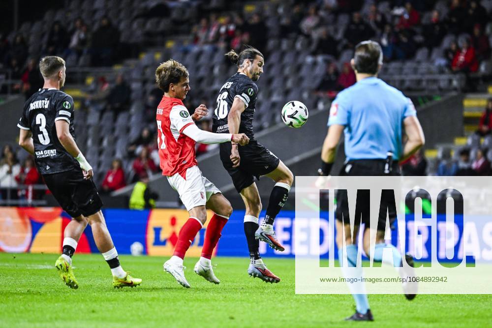 Jovan Milosevic of SC Braga and Christian Burgess of KAA Gent pictured in action during a soccer game between Portuguese SC Braga and Belgian soccer team KAA Gent, Thursday 22 October 2026 in Braga, Portugal, the second match in the UEFA Conference League league phase. TOM GOYVAERTS TomxGoyvaerts x190688371x