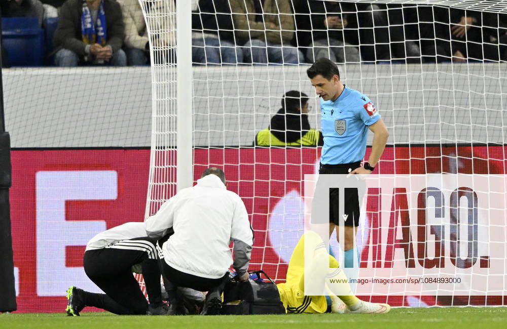 After a play in the penalty area, Goalmouth action: Goalkeeper Dominik Greif (Olympique Lyon 01) is injured during a header duel; tackle involving Felix Bacher (Olympique Lyon 20) and Ozan Kabak (TSG 1899 Hoffenheim 05), who is not in the frame; referee Umut Meler (TUR) TSG 1899 Hoffenheim vs. Olympique Lyon 22 10 2026 DFL REGULATIONS PROHIBIT ANY USE OF PHOTOGRAPHS AS IMAGE SEQUENCES AND OR QUASI-VIDEO TSG 1899 Hoffenheim vs. Olympique Lyon