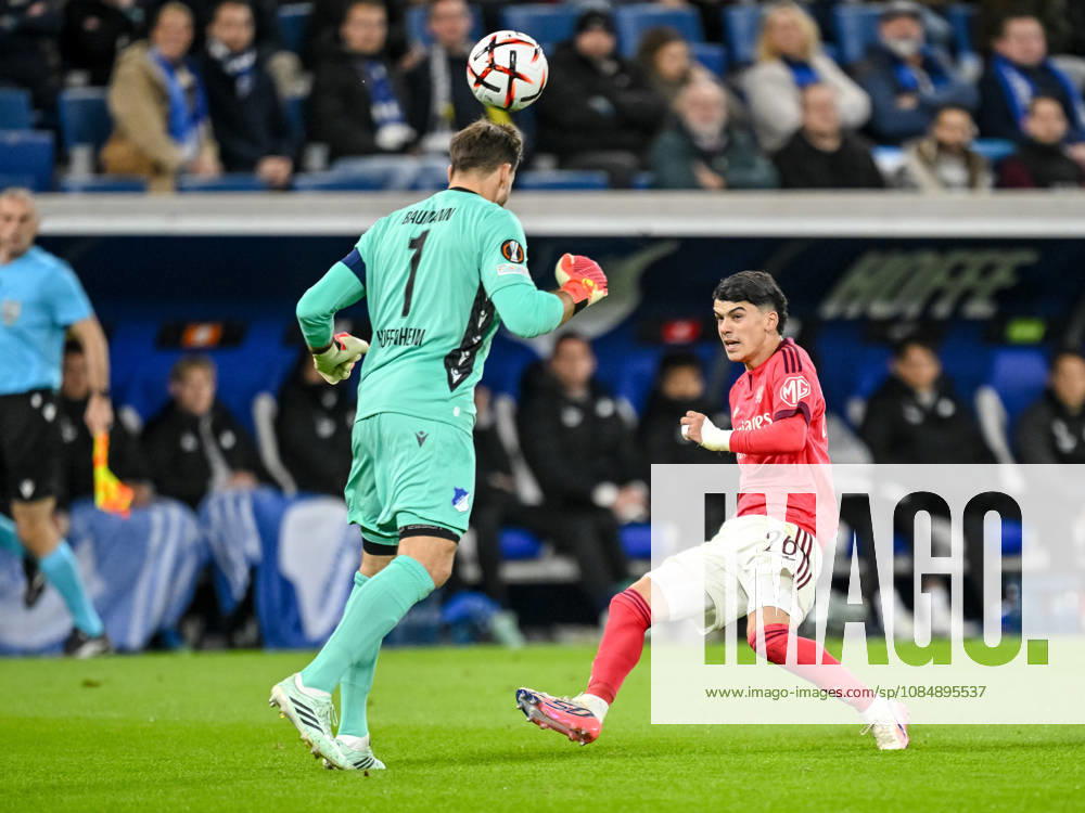 Goalkeeper Oliver Baumann of TSG 1899 Hoffenheim and Kail Boudache of Olympique Lyon battle for the ball during the UEFA Europa League 2026-27 group stage match between TSG 1899 Hoffenheim and Olympique Lyonnais at the Rhein-Neckar Arena on October 22, 2026 in Sinsheim, Germany. Photo by Harry Langer, DeFodi Images