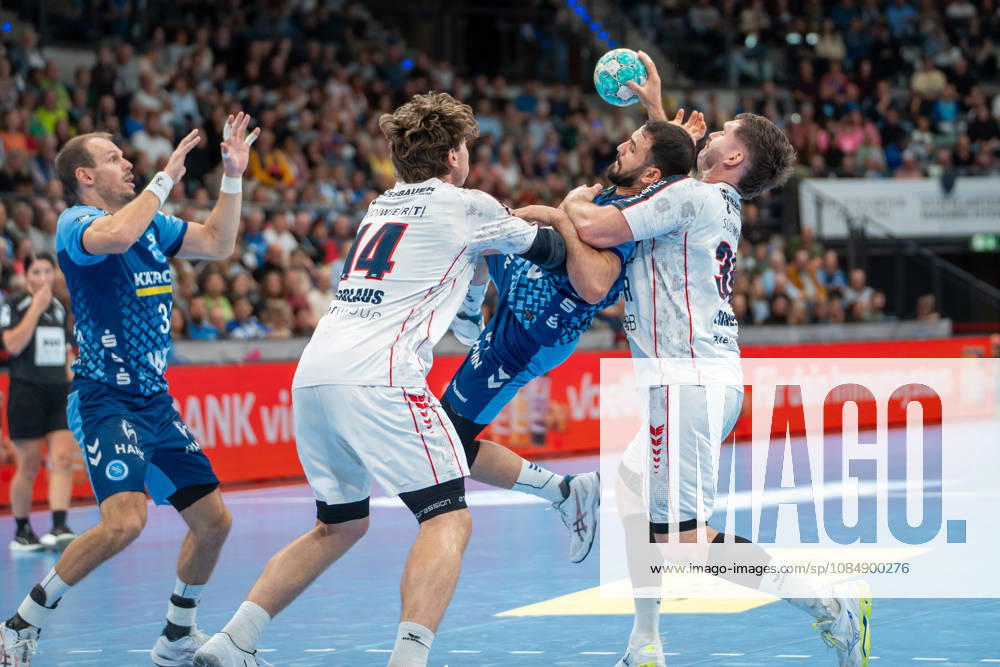 Handball I Men I 2026–2027 Season I Bundesliga I Matchday 10 I TVB Stuttgart vs. SG BBM Bietigheim I October 22, 2026 Kai Häfner 34, TVB Stuttgart, and Mohamed Amine Darmoul 70, TVB Stuttgart, Fynn Luca Nicolaus 14, SG BBM Bietigheim, and Jonathan Fischer 36, SG BBM Bietigheim, on defense at the Stuttgart Porsche Arena in Baden-Württemberg, Germany