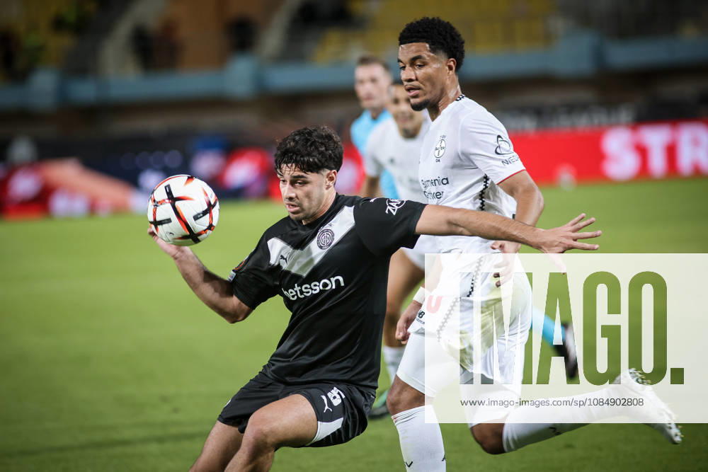 UEFA Europa League - OFI Crete vs Leverkusen - Zisis Karachalios of OFI Crete in action against Malik Tillman of Leverkusen during the UEFA Europa League phase Matchday 3 soccer match between OFI Crete vs Leverkusen in Pankritio, Heraklion, Greece, on 22 October 2026. IMAGO ONE INCH PRODUCTIONS Heraklion Greece