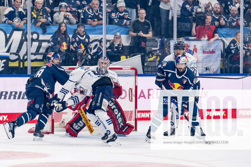 Emil Johansson of the Iserlohn Roosters, 57, and Colin Ugbekile of the Iserlohn Roosters, 79, defend against Lucas Thaler of the EHC Red Bull Munich, 48, and Tobias Rieder of the EHC Red Bull Munich, 08, in front of the net of goaltender Andreas Jenike, Iserlohn Roosters, 92 GER, EHC Red Bull Munich vs. Iserlohn Roosters, DEL, 2026–2027 season, Matchday 11, October 23, 2026. Photo: HMB Media, Franz Feiner