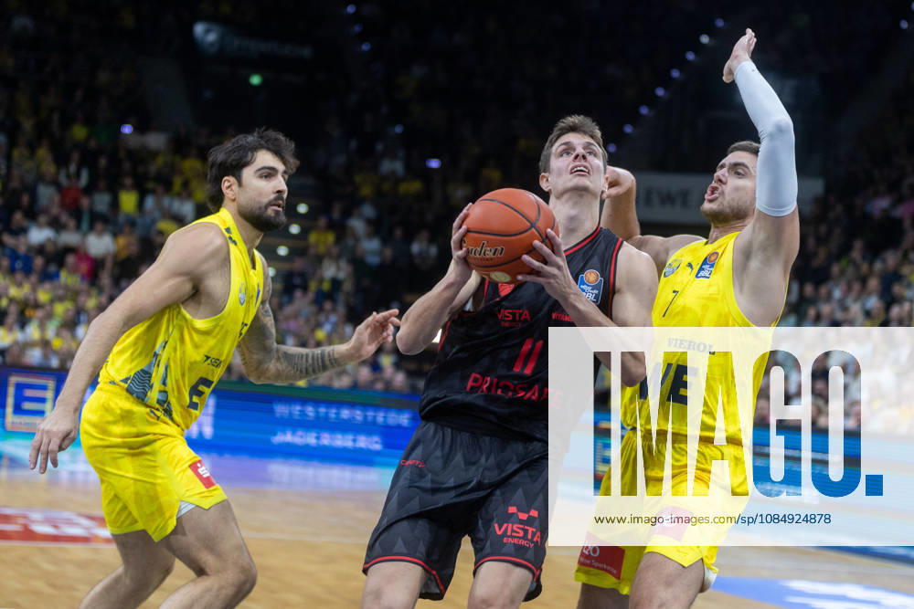 Oldenburg, Lower Saxony, Germany, October 23, 2026, Richard Balint (center), BMA365 Bamberg Baskets; Stefan Momirov (right), EWE Baskets Oldenburg; and Marcel Keßen (left), EWE Baskets Oldenburg. EWE Baskets Oldenburg vs. BMA365 Bamberg Baskets. Basketball 1. Basketball Bundesliga, 2026–2027 season, Matchday 6, Grosse EWE Arena: EWE Baskets Oldenburg vs. BMA365 Bamberg Baskets www.andreas-burmann.de