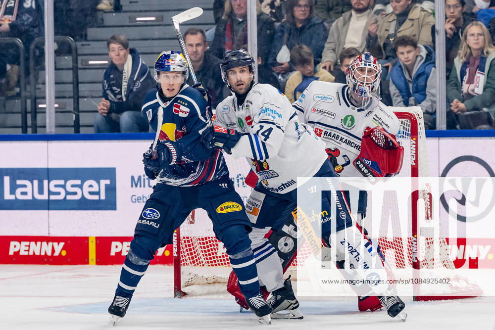 Cole Maier of the Iserlohn Roosters, No. 14, defends against Elis Hede of the EHC Red Bull Munich, No. 10, in front of the net of Andreas Jenike, goaltender for the Iserlohn Roosters, No. 92, GER, EHC Red Bull Munich vs. Iserlohn Roosters, DEL, 2026–2027 season, Matchday 11, October 23, 2026. Photo: HMB Media, Franz Feiner