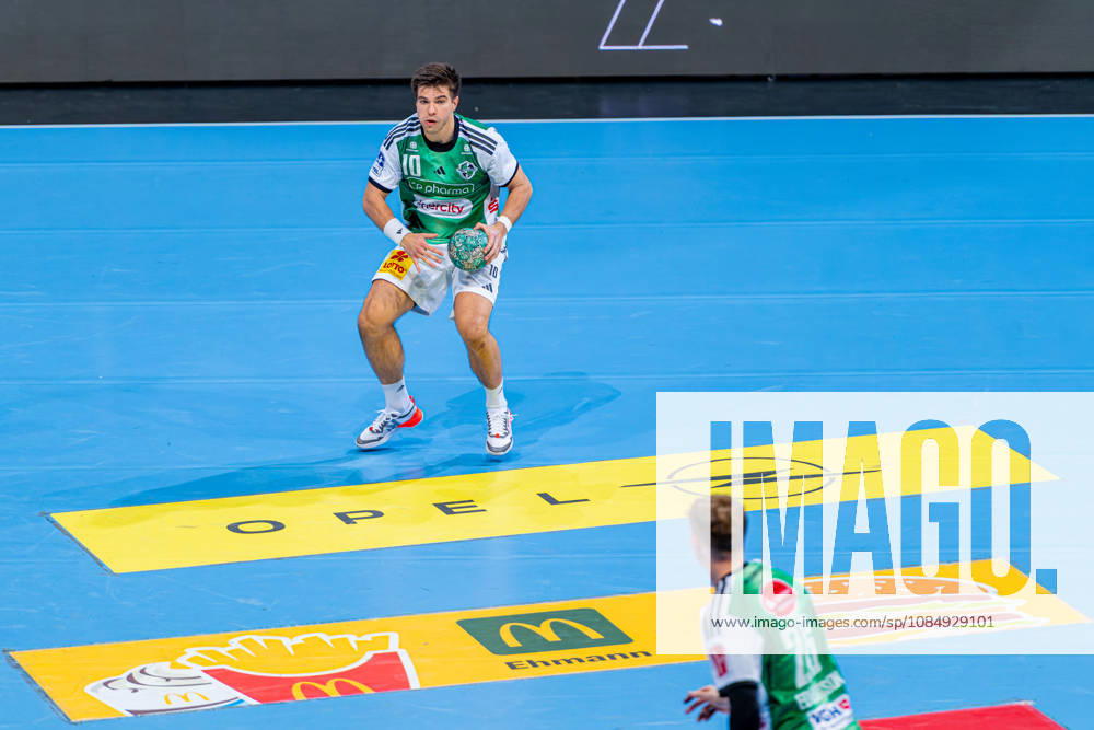 Renars Uscins of TSV Hannover Burgdorf, No. 10 from the left, TSV Hannover Burgdorf (green) vs. TBV Lemgo Lippe (blue) on Matchday 10 of the 2026–2027 season in the Opel Handball Bundesliga, October 23, 2026, ZAG Arena Hannover, GER,