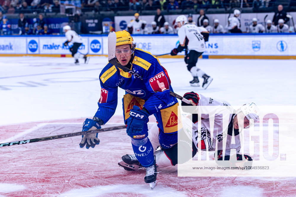 Philipp Kurashev 23 Lausanne HC is checked by top scorer Vinzenz Rohrer of EV Zug 23 10 2026 National League, Regular Season, Ice Hockey, OYM Hall, Zug EV Zug Lausanne HC Image by