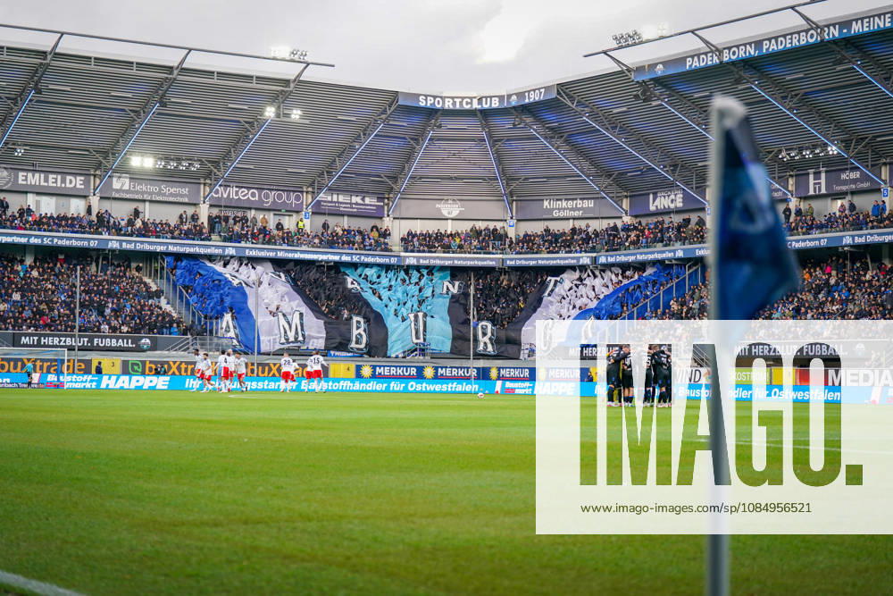 Germany Soccer Bundesliga 2026–2027, Matchday 7: SC Paderborn vs. Hamburger SV at Home Deluxe Arena, Paderborn. Panoramic view of the Home Deluxe Arena in Paderborn; interior shot featuring a large blue, black, and white choreographed display by SC Paderborn 07 home fans in the stands; HAMBURG fan choreography; Ultras, fan scene, spectators, flags, fan section, stadium, sports venue, soccer, Bundesliga, team huddle, Hamburger SV, SC Paderborn, corner flag, playing field, floodlights, stadium roof, advertising, sponsors, advertising banners, Merkur, buXtrade, Bad Driburger, Happe, atmosphere