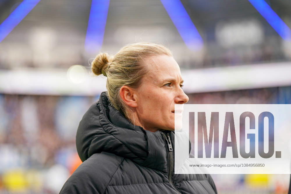 Germany Soccer Bundesliga 2026–2027, Matchday 7: SC Paderborn vs. Hamburger SV at Home Deluxe Arena in Paderborn. Kathleen Krüger, sporting director of Hamburger SV (HSV), the first full-time female sporting director in Bundesliga history and former team manager of FC Bayern Munich. Portrait, close-up on the sidelines at Home Deluxe Arena in Paderborn, wearing a black winter jacket, smiling, looking to the side; soccer, Bundesliga, SC Paderborn 07, Hamburger SV, sports management, sports director, club leadership, female official, women in soccer, management, sports venue, facial expressions, emotion