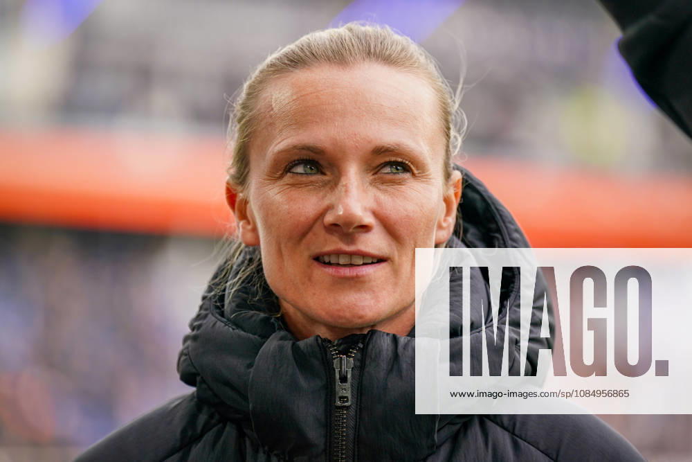 Germany Soccer Bundesliga 2026–2027, Matchday 7: SC Paderborn vs. Hamburger SV at Home Deluxe Arena in Paderborn. Kathleen Krüger, sporting director of Hamburger SV (HSV), the first full-time female sporting director in Bundesliga history and former team manager of FC Bayern Munich. Portrait, close-up on the sidelines at Home Deluxe Arena in Paderborn, wearing a black winter jacket, smiling, looking to the side; soccer, Bundesliga, SC Paderborn 07, Hamburger SV, sports management, sports director, club leadership, female official, women in soccer, management, sports venue, facial expressions, emotion