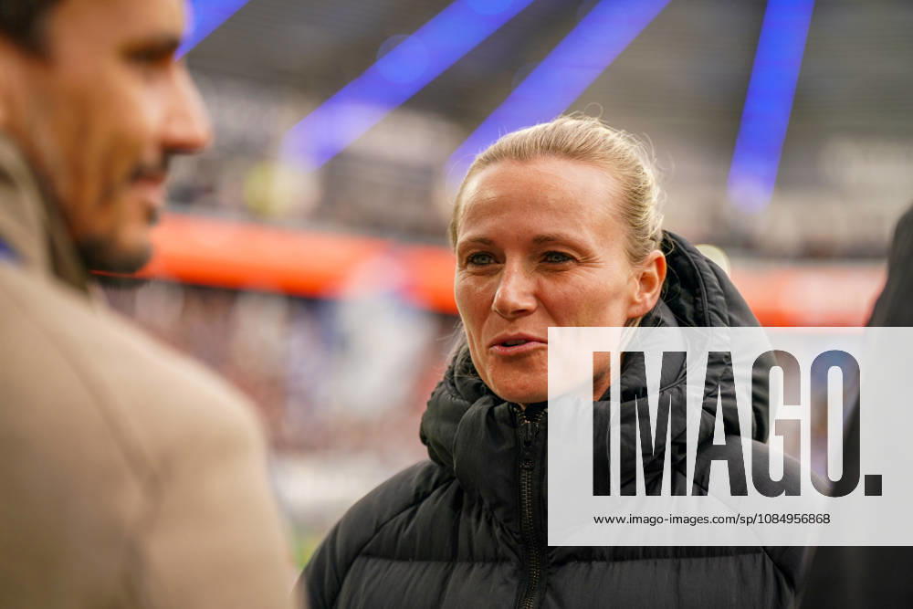 Germany Soccer Bundesliga 2026–2027, Matchday 7: SC Paderborn vs. Hamburger SV at Home Deluxe Arena in Paderborn. Kathleen Krüger, sporting director of Hamburger SV (HSV), the first full-time female sporting director in Bundesliga history and former team manager of FC Bayern Munich. Portrait, close-up on the sidelines at Home Deluxe Arena in Paderborn, wearing a black winter jacket, smiling, looking to the side; soccer, Bundesliga, SC Paderborn 07, Hamburger SV, sports management, sports director, club leadership, female official, women in soccer, management, sports venue, facial expressions, emotion