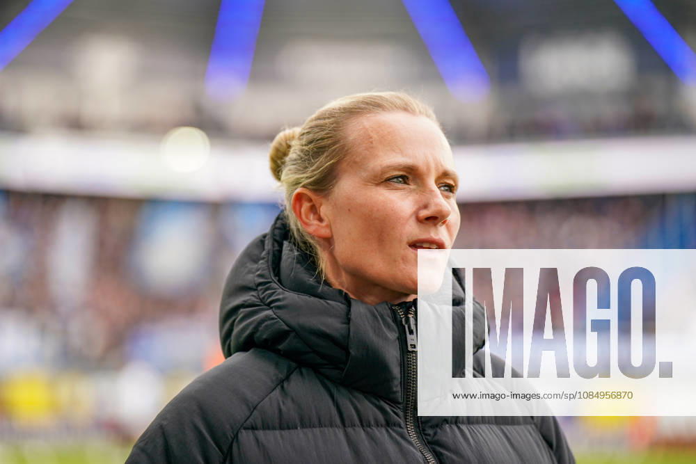 Germany Soccer Bundesliga 2026–2027, Matchday 7: SC Paderborn vs. Hamburger SV at Home Deluxe Arena in Paderborn. Kathleen Krüger, sporting director of Hamburger SV (HSV), the first full-time female sporting director in Bundesliga history and former team manager of FC Bayern Munich. Portrait, close-up on the sidelines at Home Deluxe Arena in Paderborn, wearing a black winter jacket, smiling, looking to the side; soccer, Bundesliga, SC Paderborn 07, Hamburger SV, sports management, sports director, club leadership, female official, women in soccer, management, sports venue, facial expressions, emotion