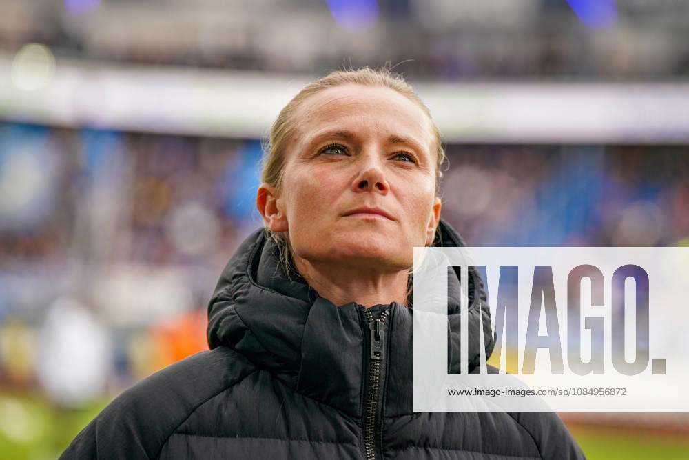 Germany Soccer Bundesliga 2026–2027, Matchday 7: SC Paderborn vs. Hamburger SV at Home Deluxe Arena in Paderborn. Kathleen Krüger, sporting director of Hamburger SV (HSV), the first full-time female sporting director in Bundesliga history and former team manager of FC Bayern Munich. Portrait, close-up on the sidelines at Home Deluxe Arena in Paderborn, wearing a black winter jacket, smiling, looking to the side; soccer, Bundesliga, SC Paderborn 07, Hamburger SV, sports management, sports director, club leadership, female official, women in soccer, management, sports venue, facial expressions, emotion