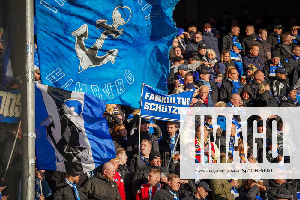 Germany Soccer Bundesliga 2026–2027, Matchday 7: SC Paderborn vs. Hamburger SV at Home Deluxe Arena in Paderborn. Away fans of Hamburger SV (HSV) in the visitors’ section at Home Deluxe Arena in Paderborn. Large blue-and-black HSV flags featuring an anchor and the word Hamburg, as well as a banner. Protecting fan culture: fans, ultras, the fan scene, fan culture, fan protest, spectators, flags, banners, stands, fan section, atmosphere, support, away game, soccer, Bundesliga, SC Paderborn 07, Hamburger SV, stadium, sports venue, fan rights, protect fan culture, wide shot