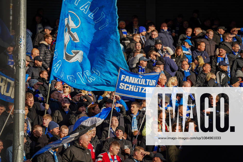 Germany Soccer Bundesliga 2026–2027, Matchday 7: SC Paderborn vs. Hamburger SV at Home Deluxe Arena in Paderborn. Away fans of Hamburger SV (HSV) in the visitors’ section at Home Deluxe Arena in Paderborn. Large blue-and-black HSV flags featuring an anchor and the word Hamburg, as well as a banner. Protecting fan culture: fans, ultras, the fan scene, fan culture, fan protest, spectators, flags, banners, stands, fan section, atmosphere, support, away game, soccer, Bundesliga, SC Paderborn 07, Hamburger SV, stadium, sports venue, fan rights, protect fan culture, wide shot