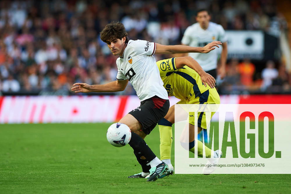 Carlos Macia of Villarreal CF and Javi Guerra of Valencia CF during the LaLiga EA Sports match between Valencia CF and Villarreal CF at Mestalla on October 24, 2026, in Valencia, Spain