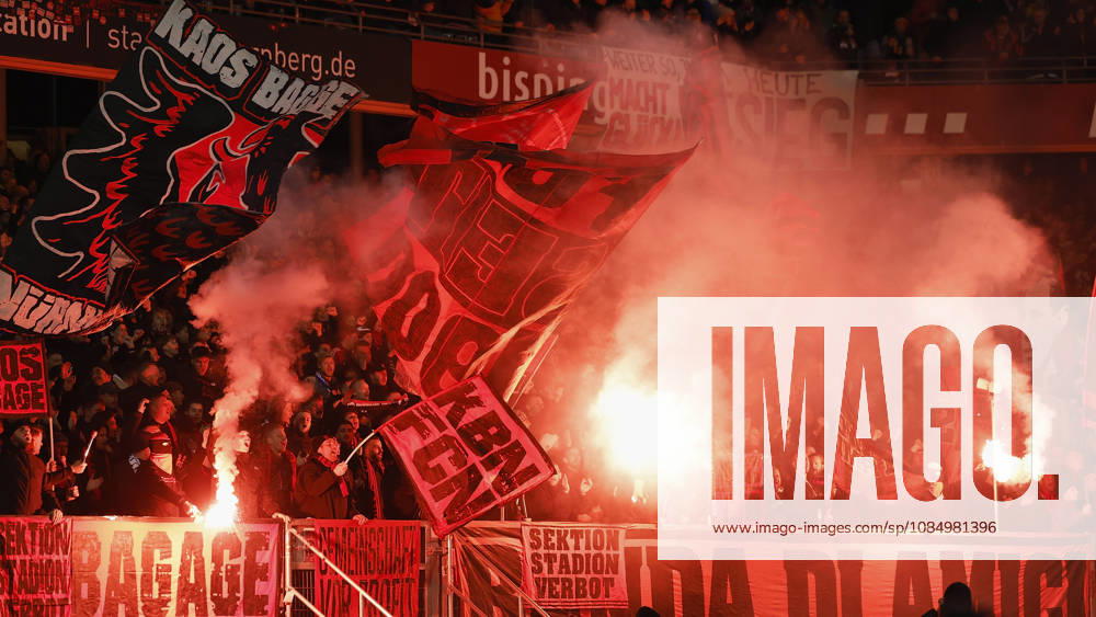 Pyro, pyrotechnics, smoke pots, flares, fireworks among the Nuremberg fans, from left to right, during the 2. Bundesliga match between 1. FC Nuremberg and 1. FC Kaiserslautern at Max Morlock Stadium, Nuremberg, Germany, on October 24, 2026. DFB and DFL regulations prohibit any use of photographs as image sequences and or quasi-video,
