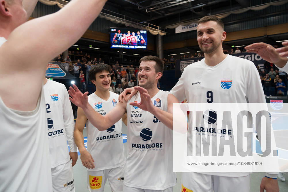 Vuk Radojicic (MBC), 4, Spencer Reaves (MBC), 31, and Kresimir Nikic (MBC), 9, celebrate the 103–98 overtime home victory in the Syntainics MBC vs. Rostock Seawolves game, BBL, Men’s Basketball 1st Bundesliga, Matchday 6 of the 2026–27 season, October 24, 2026, Weißenfels Stadthalle, Saxony-Anhalt, Germany