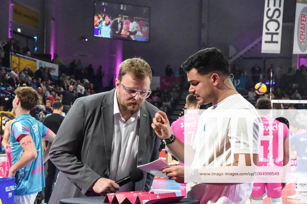 Tomasz Wasilkowski, Head Coach of WWK Volleys Munich; Philipp Ferebauer, arena announcer during the interview; TV, television, microphone; October 24, 2026; Düren, Germany; volleyball; Men s Bundesliga 1; regular season; SWD Powervolleys Düren vs. WWK Volleys Munich