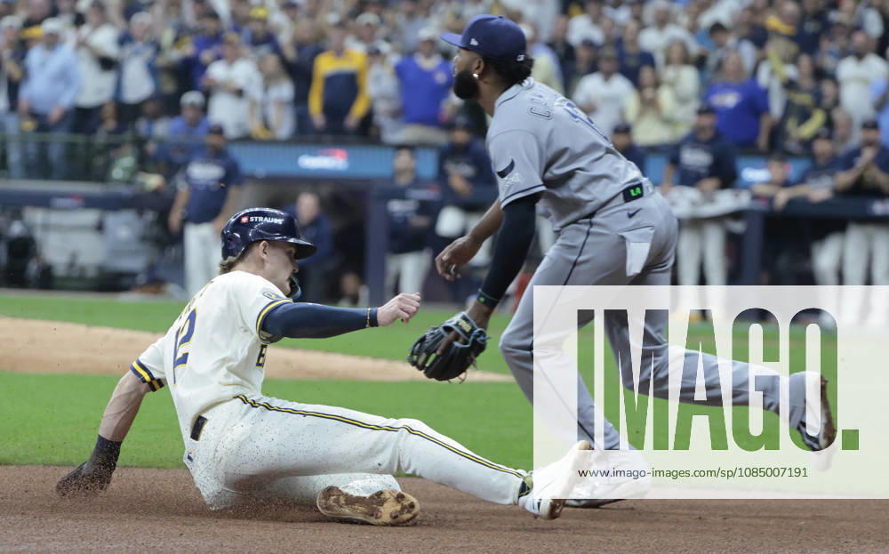 Milwaukee Brewers Cooper Pratt (12) slides safely into third base as Tampa Bay Rays third baseman Junior Caminero (13) waits for the throw in the fourth inning during game two of the 2026 MLB, Baseball Herren, USA World Series at American Family Field in Milwaukee, Wisconsin, on Saturday, October 24, 2026. MIL20261024725 TANNENxMAURY