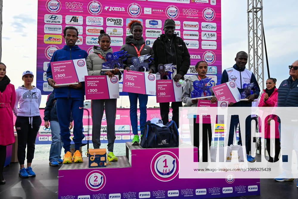 IPA90162064 - The podium with the men s and women s winners at the 40th Venice Marathon 2026, a marathon race in Venice, Italy, on October 25, 2026