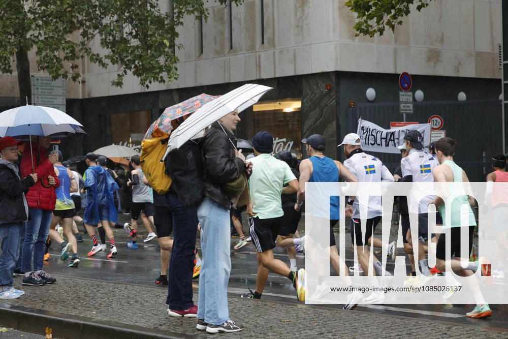 Track and Field 43 Mainova Frankfurt Marathon in the Rain Spectators with Umbrellas Frankfurt, Main, Hesse, Germany