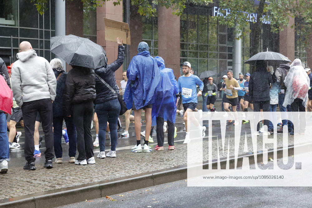 Track and Field 43 Mainova Frankfurt Marathon in the Rain Spectators with Umbrellas Frankfurt, Main, Hesse, Germany