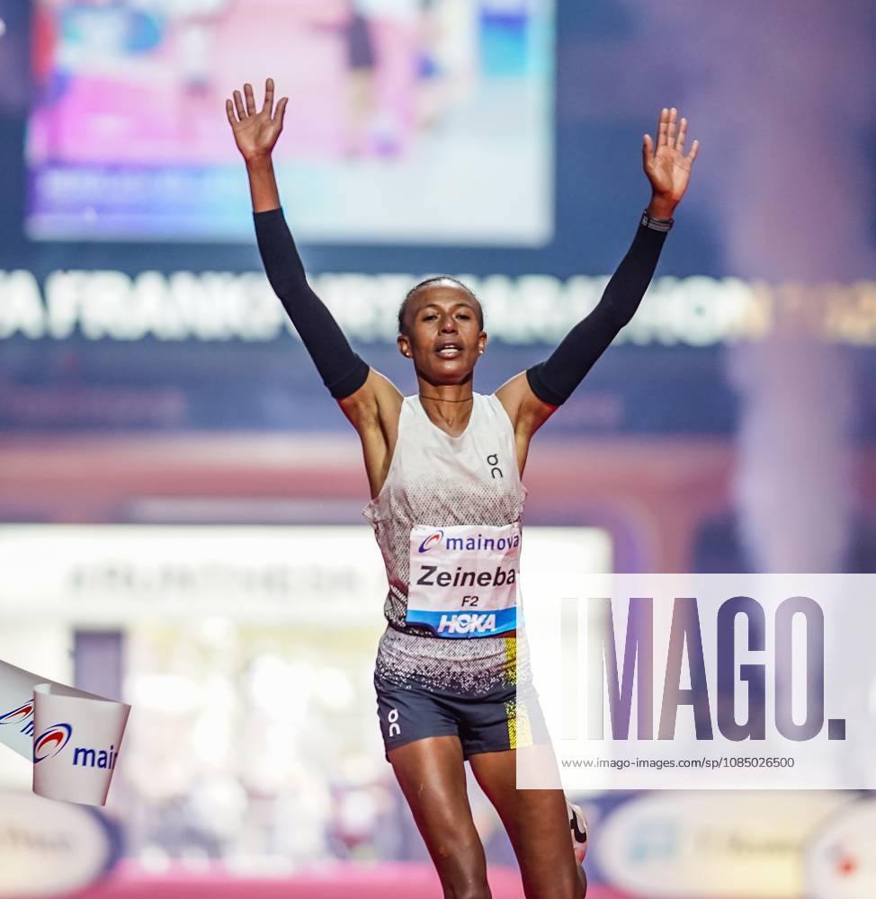 Ethiopian Zeineba Yimer Wins the Mainova Frankfurt Marathon in 2:19:45:25:10:26—A Triumphant Finish at the Festhalle. Zeineba Yimer of Ethiopia wins the women’s race at the Mainova Frankfurt Marathon with a winning time of 2:19:45 hours Frankfurt Festhalle Hesse Germany JRW02160