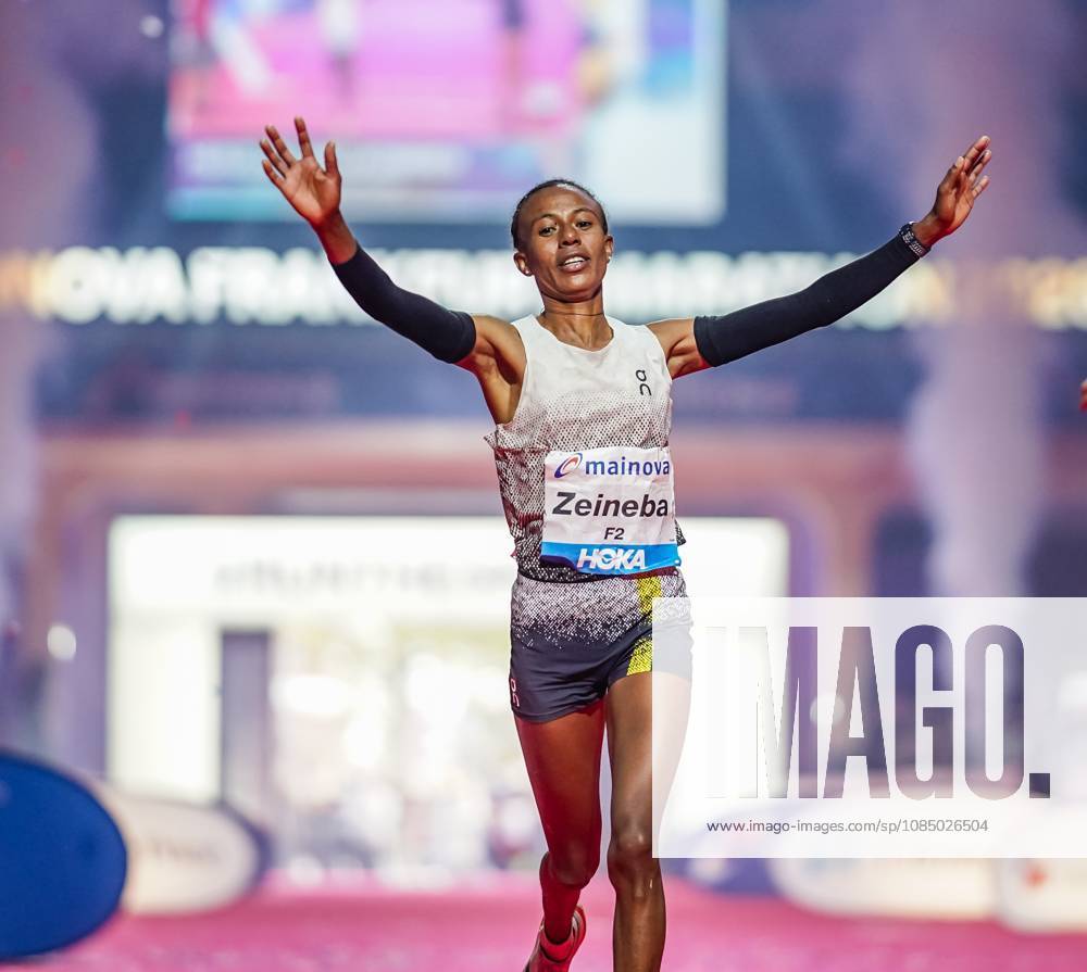 Ethiopian Zeineba Yimer Wins the Mainova Frankfurt Marathon in 2:19:45:25:10:26—A Triumphant Finish at the Festhalle. Zeineba Yimer of Ethiopia wins the women’s race at the Mainova Frankfurt Marathon with a winning time of 2:19:45 hours Frankfurt Festhalle Hesse Germany JRW02162