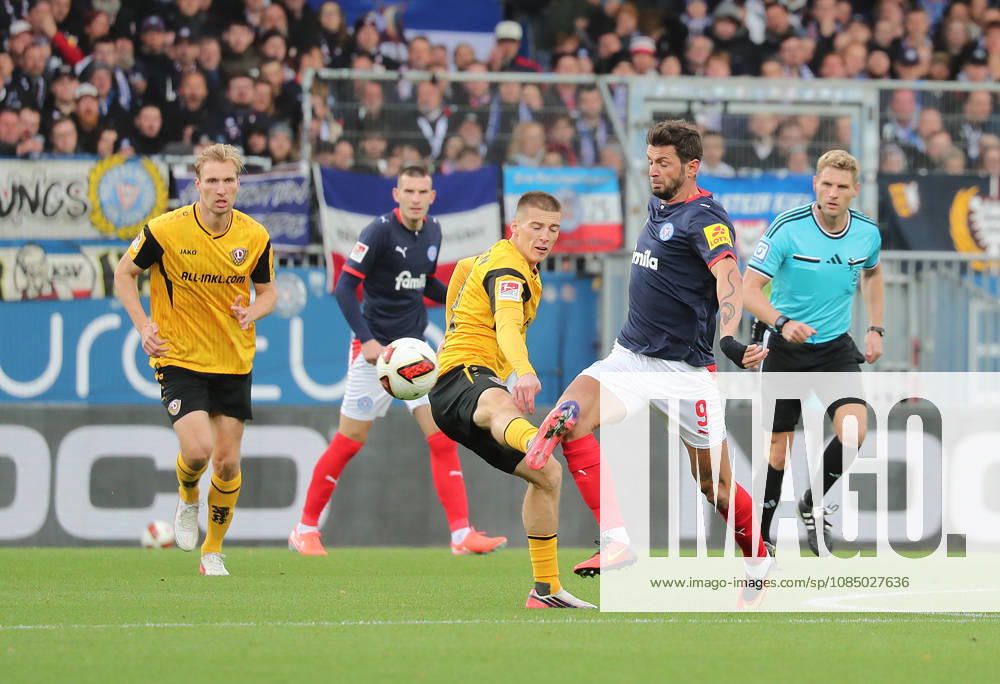 Giorgi Kvilitaia, Holstein Kiel; Niklas Hauptman, Dynamo Dresden; Soccer, Men s, 2026–2027 Season, 2. Bundesliga, Holstein Stadium, Holstein Kiel vs. Dynamo Dresden. DFL regulations prohibit any use of photographs as image sequences and or quasi-video.