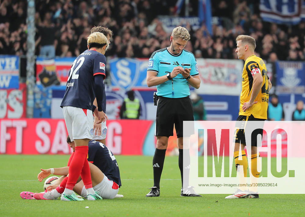 Referee Timo Gerach, Adrian Kapralik (Holstein Kiel), Niklas Hauptman (Dynamo Dresden); Soccer, Men s, 2026–2027 Season, 2. Bundesliga, Holstein Stadium, Holstein Kiel vs. Dynamo Dresden. DFL regulations prohibit any use of photographs as image sequences and or quasi-video.