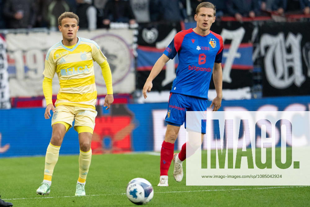 BASEL, SWITZERLAND, OCTOBER 24—Kenzo Goudmijn of Grasshoppers (L) battles for the ball with Becir Omeragic of Basel (R) during the Swiss Super League match between FC Basel 1893 and Grasshopper Club Zurich at St. Jakob Park on September 20, 2026 in Basel, Switzerland