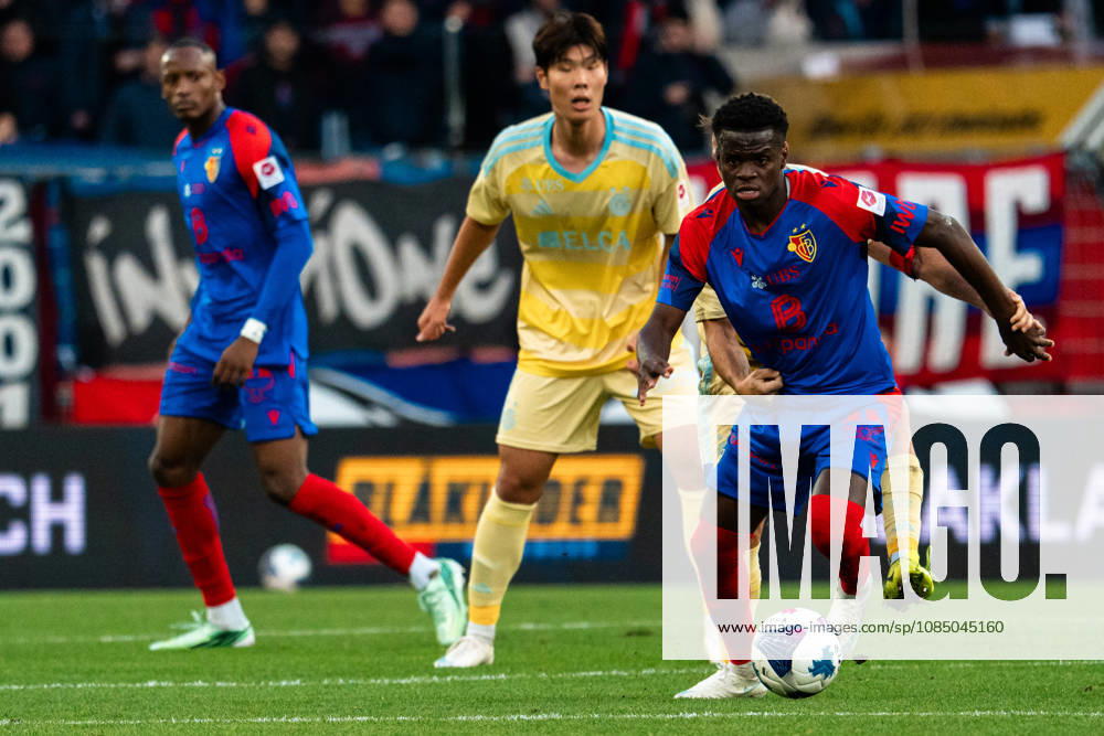 BASEL, SWITZERLAND, OCTOBER 24: L R Akpe of Basel, Lee Young Jun of Grasshoppers and Metinho of Basel control the ball during the Swiss Super League match between FC Basel 1893 and Grasshopper Club Zurich at St. Jakob Park on September 20, 2026, in Basel, Switzerland