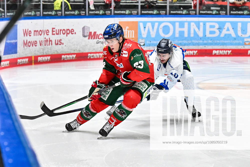 Penny DEL: Augsburger Panther vs. Straubing Tigers, October 25, 2026, AUGSBURG, GERMANY, OCTOBER 25: Jimmy LAMBERT of the Augsburger Panther (23) and Taro JENTZSCH of the Straubing Tigers (10) face off during the Penny DEL match between the Augsburger Panther and the Straubing Tigers on Matchday 12 at Curt Frenzel Stadium