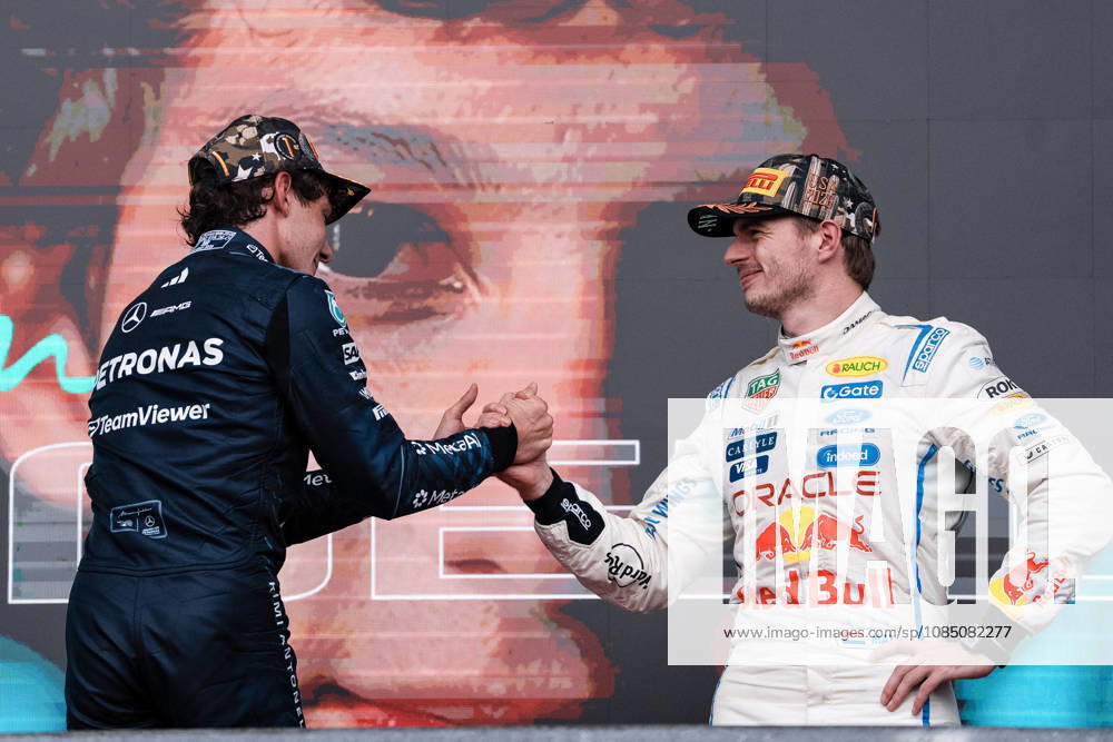AUSTIN, UNITED STATES, OCT 25: Race winner Andrea Kimi Antonelli of Italy and Mercedes AMG Petronas F1 Team (L) greets Third placed Max Verstappen of the Netherlands and Oracle Red Bull Racing (R) on the podium during the F1 Grand Prix of United States at Circuit of The Americas on October 25, 2026 in Austin, Texas (photo by Richard Callis SPP)