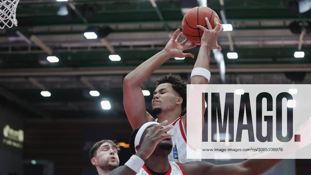 Pictured from left: Elias Roedl (NINERS Chemnitz, 11), Charles Thompson (Wuerzburg Baskets, 32), and Brandon Tischler (Wuerzburg Baskets, 8) in a battle for rebounds on October 26, 2026,Fitness First Würzburg Baskets vs. NINERS Chemnitz, easyCredit BBL, Matchday 6, Germany, 97072, tectake Arena Würzburg,