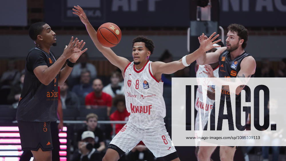 Pictured from left: Nighael Ceaser (NINERS Chemnitz), 22, with the ball; Brandon Tischler (Wuerzburg Baskets), 8; Charles Thompson (Wuerzburg Baskets), 32; and Ben Burnham (NINERS Chemnitz), 25. 26 10 2026,Fitness First Würzburg Baskets vs. NINERS Chemnitz, easyCredit BBL, Matchday 6, Germany, 97072, tectake Arena Würzburg,
